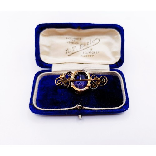 139A - A 9ct gold and amethyst brooch, cased