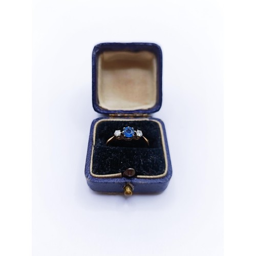 143A - An 18ct gold acquamarine and diamond ring, ring size N, with a vintage ring box