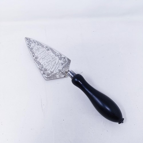 420 - A sterling silver commemorative trowel with an ebonised handle