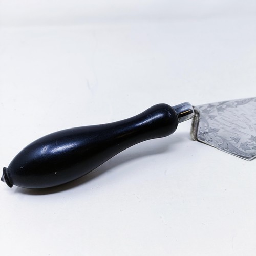 420 - A sterling silver commemorative trowel with an ebonised handle