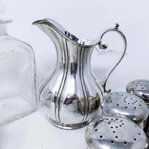 421 - A silver pepperette, a silver mounted bottle, a set of eight silver plated pepper pots with blue gla... 