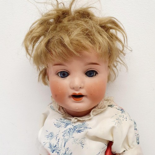 65 - An Armand Marseille German bisque headed doll, No 996, with a jointed composite body, and millefiori... 