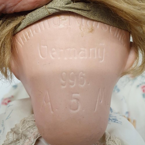 65 - An Armand Marseille German bisque headed doll, No 996, with a jointed composite body, and millefiori... 