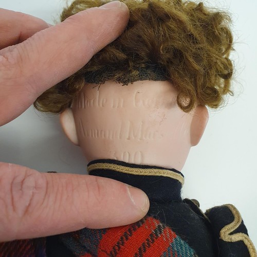 67 - An Armand Marseille bisque headed Scottish Boy doll, No 390, with a jointed composite body, millefio... 