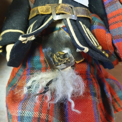 67 - An Armand Marseille bisque headed Scottish Boy doll, No 390, with a jointed composite body, millefio... 