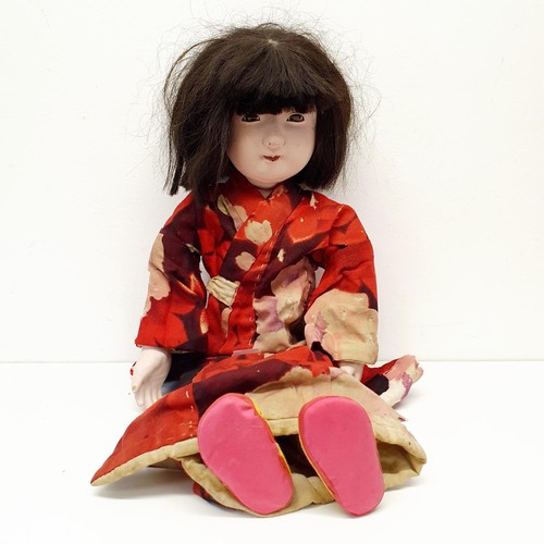 60 - A Japanese style bisque headed doll, with a cloth and bisque body, in a traditional outfit, 64 cm
Pr... 