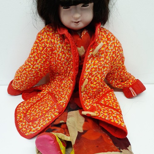 60 - A Japanese style bisque headed doll, with a cloth and bisque body, in a traditional outfit, 64 cm
Pr... 