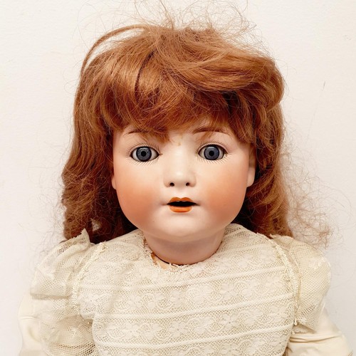 61 - A Heubach bisque headed doll, with a composite body, and millefiori glass eyes, 56 cm
Provenance:  F... 