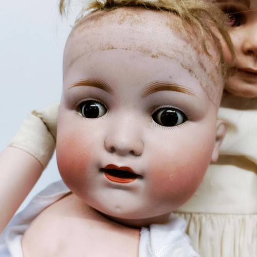 63 - An Armand Marseille German bisque head doll, with composite body and millefiori glass eyes, lacking ... 