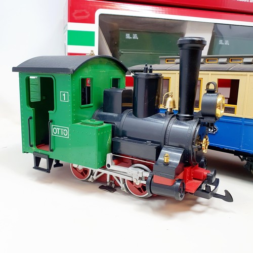 56 - A Lehmann Gross Bahn (LGB) G scale 0-4-0 locomotive, two carriages, and related items (2 boxes)