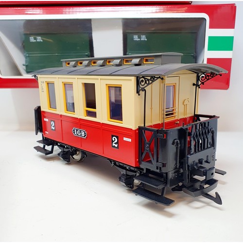 56 - A Lehmann Gross Bahn (LGB) G scale 0-4-0 locomotive, two carriages, and related items (2 boxes)