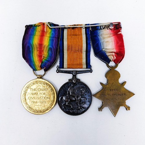 163 - A 1914-15 Star Trio, awarded to 2219 Pte P Whitley, Manchester Reg