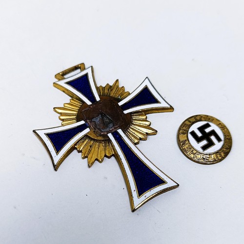 168 - A Third Reich mother's cross, centre enamel swastika detached but present