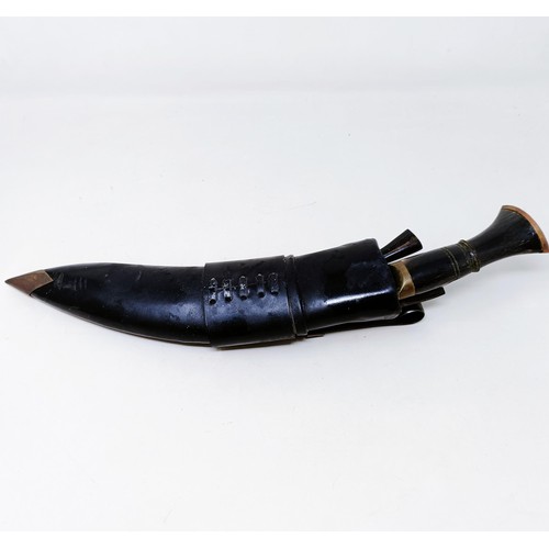 148 - A Kukri, with accessories and a scabbard, 42 cm