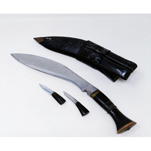 148 - A Kukri, with accessories and a scabbard, 42 cm