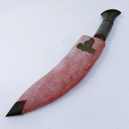 150 - A Kukri, with a scabbard, 37 cm, and a copper and silver coloured metal tray, 50 cm diameter (2)