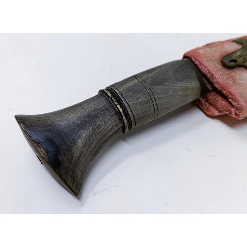 150 - A Kukri, with a scabbard, 37 cm, and a copper and silver coloured metal tray, 50 cm diameter (2)