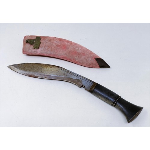 150 - A Kukri, with a scabbard, 37 cm, and a copper and silver coloured metal tray, 50 cm diameter (2)