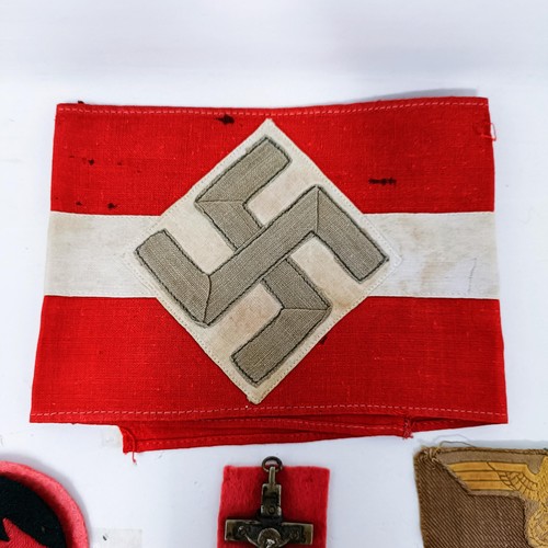 139 - A German Third Reich armband, a Mine Field warning pennant, a Kriegsmarine cap band and other items ... 