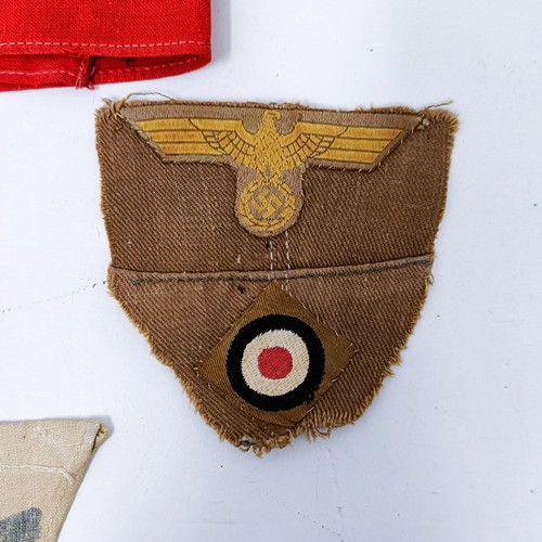 139 - A German Third Reich armband, a Mine Field warning pennant, a Kriegsmarine cap band and other items ... 