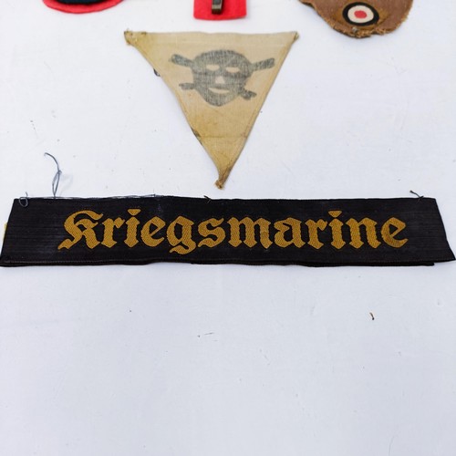 139 - A German Third Reich armband, a Mine Field warning pennant, a Kriegsmarine cap band and other items ... 