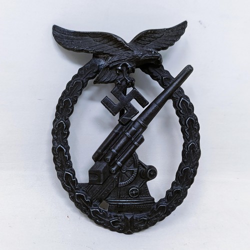 141 - A German Third Reich anti-aircraft flak battle badge 
Provenance:  Formerly the property of Richard ... 