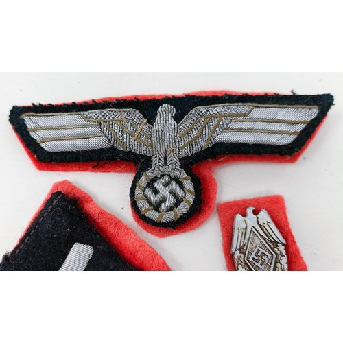 138 - A German Third Reich SS collar insignia, a similar tunic insignia, and another small badge
Provenanc... 