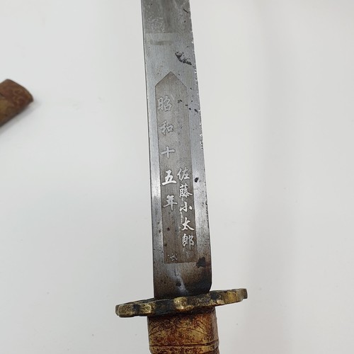 190 - A Japanese Tanto, the 27 cm blade with characters, having a single molded handle, in a scabbard, 45 ... 