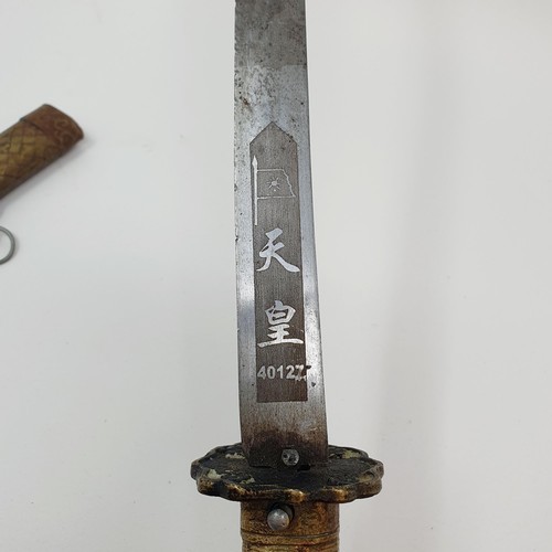 190 - A Japanese Tanto, the 27 cm blade with characters, having a single molded handle, in a scabbard, 45 ... 