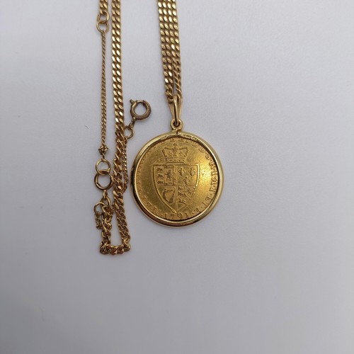 224 - A George III gold spade guinea, 1791, in an 18ct mount and chain