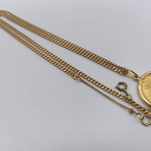 224 - A George III gold spade guinea, 1791, in an 18ct mount and chain