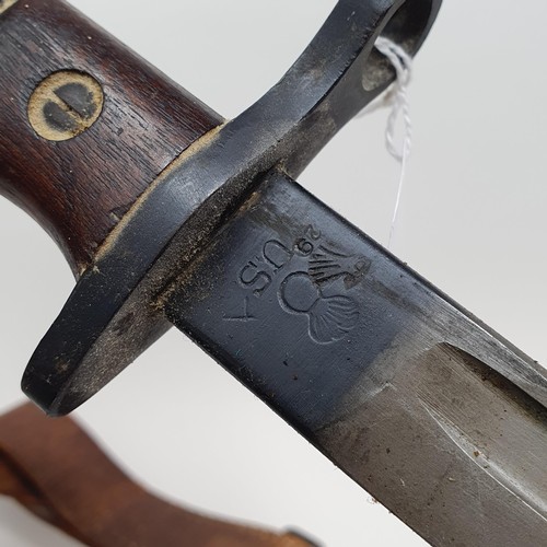 188 - A US Remington bayonet, dated 1917, with scabbard and leather hanger