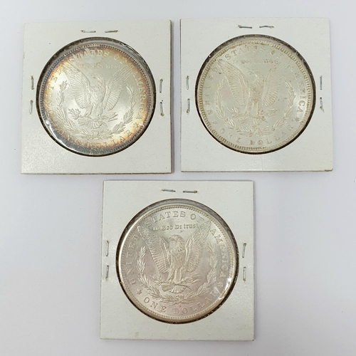 240 - A USA Morgan $1, 1885, and two others, 1879 (S) and 1889 (3)