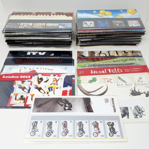 353 - A large group of assorted presentation packs, and other commemorative stamps