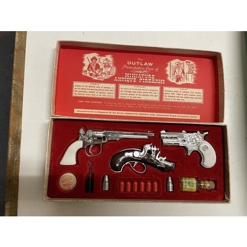 71 - An electric model of a Vauxhall Velox (boxed) and an Outlaw miniature antique firearm set (boxed) (2... 