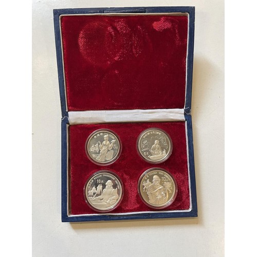 219 - Four Chinese silver coins in box, two 5f 1989 and two 10f 1990, cased