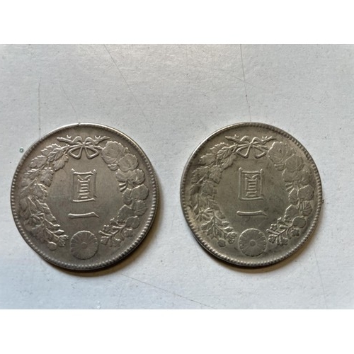 217 - Two Japanese 410-900 one-yen coins