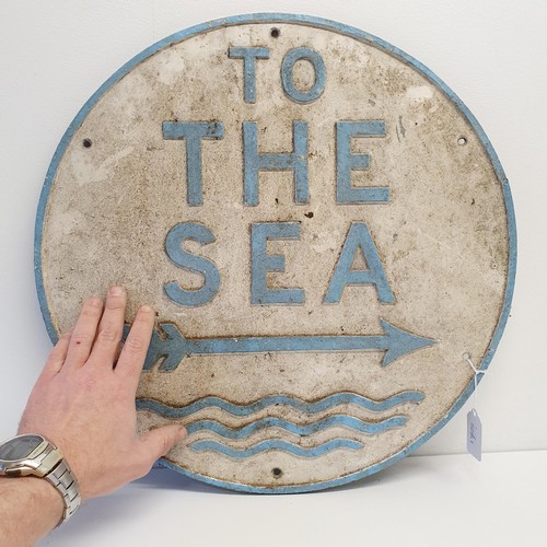 53 - An aluminium sign, TO THE SEA, 46 cm diameter