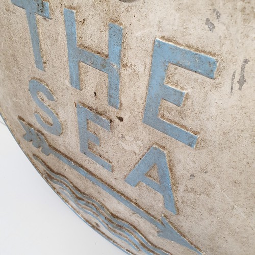 53 - An aluminium sign, TO THE SEA, 46 cm diameter