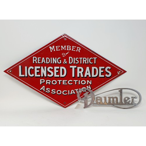 68 - An enamel sign, Member Reading & District License Trades Protection Association, and a Daimler badge... 