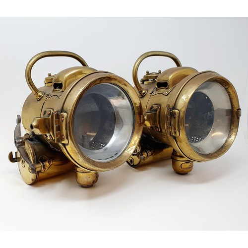 145 - A pair of early 20th century Powell & Hammer brass acetylene headlamps, 25 cm high