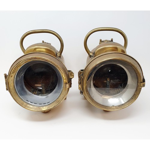 145 - A pair of early 20th century Powell & Hammer brass acetylene headlamps, 25 cm high