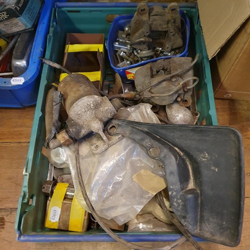 96 - A car trunk, trolley jacks, various car parts, including Toyota MR2, a steering wheel, and other ite... 