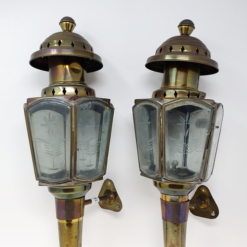 136 - A pair of early 20th century brass coaching lamps, 47 cm high (2)