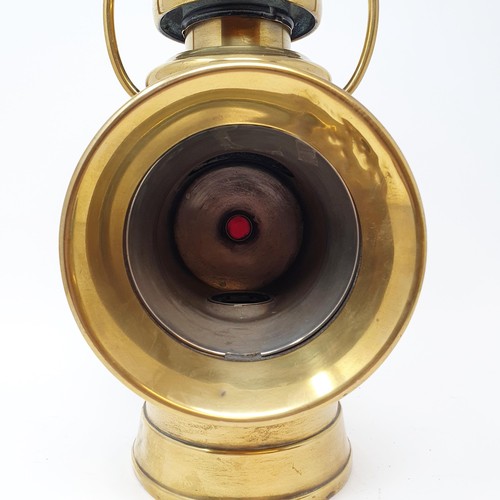 139 - An early 20th century Lucas brass oil headlamp, lacks lens, 32 cm high