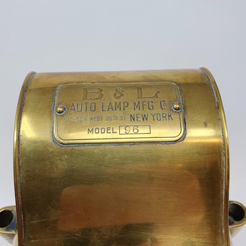 140 - An early 20th century B & L Auto Lamp MFG Co Model 96 brass ascetylene headlamp, 24 cm high