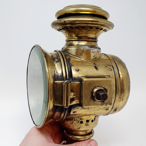 141 - An early 20th century Phare SantyGan brass oil sidelamp, lens cracked, 26 cm high