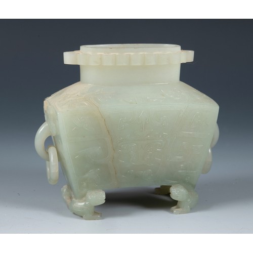 316 - A Chinese carved jade censer, with ring handles, on dragon feet, lacking its cover, 11 cm high