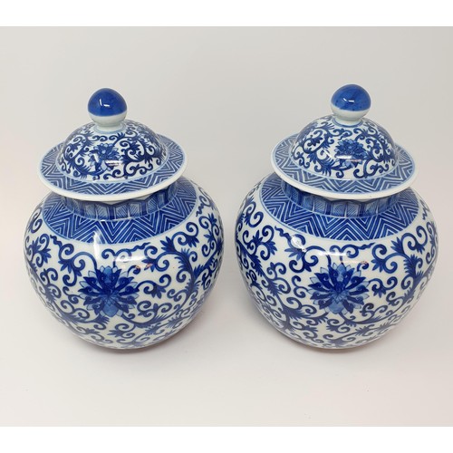 326 - A pair of Chinese underglazed blue and white vases and covers, decorated foliate forms, six characte... 