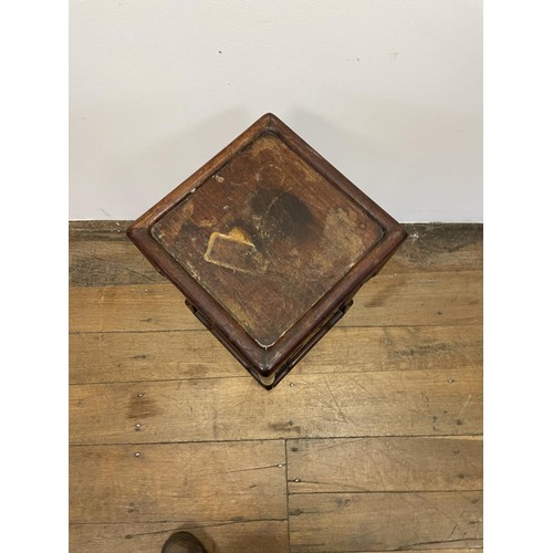 370 - A Chinese hardwood pedestal, with a pierced frieze, 58 cm high, 28 cm wide